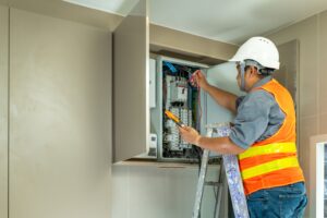 Electrician inspecting electrical panel