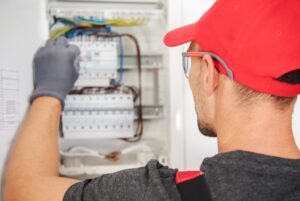 Electrician inspects a circuit box